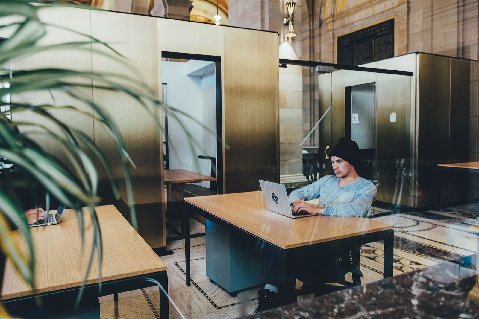 Person working on a laptop in a bright office